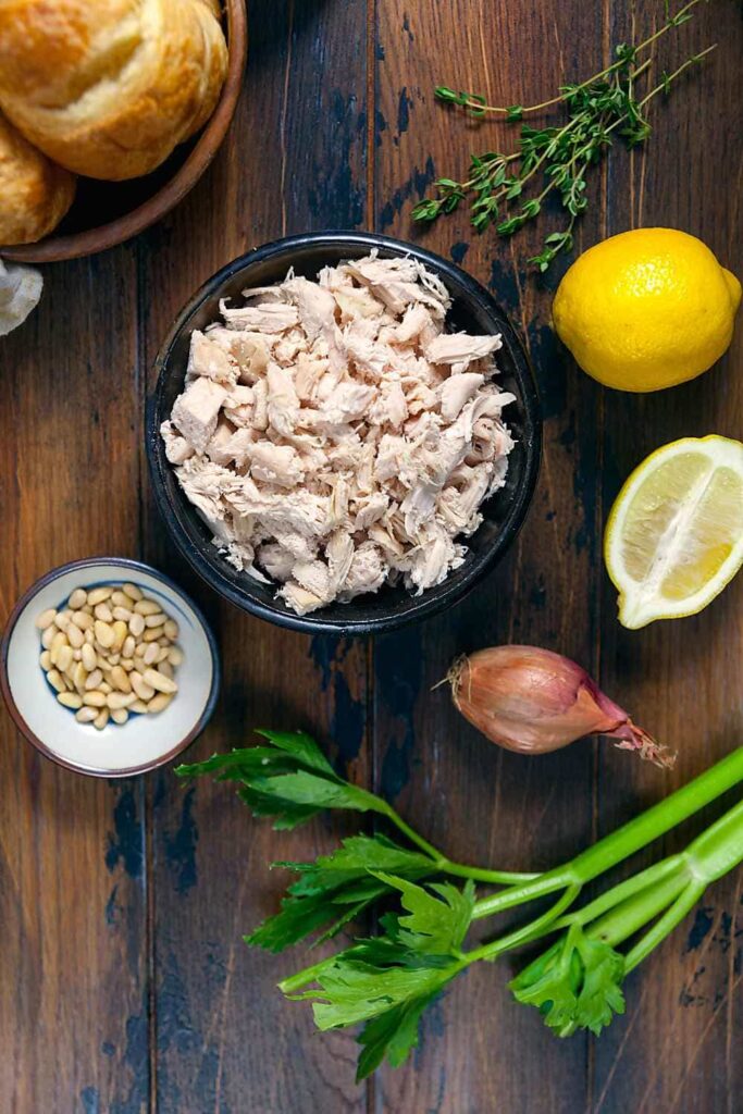 Ingredients for making chicken salad with lemon and herbs