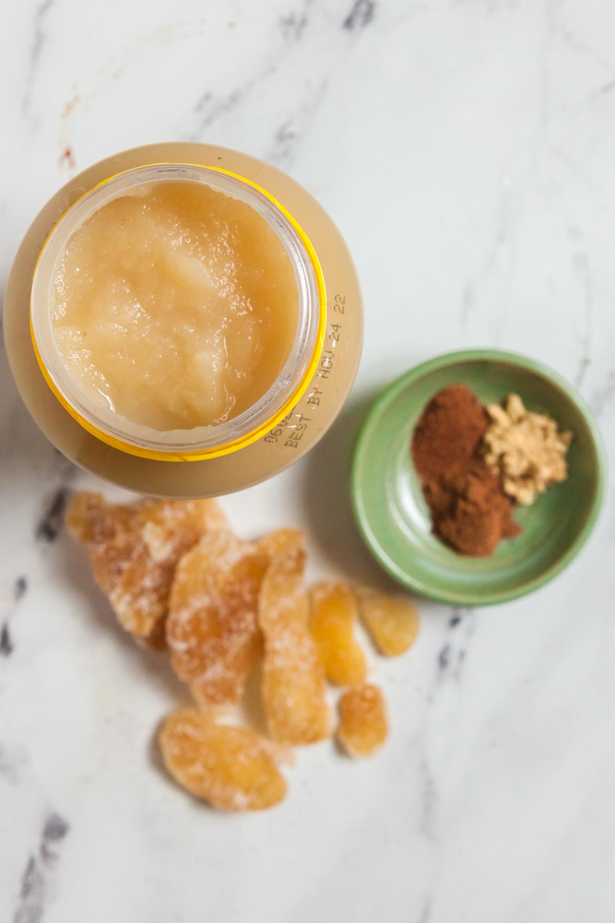 Ingredients for applesauce bread include unsweetened applesauce, candied ginger, and warm spices. 