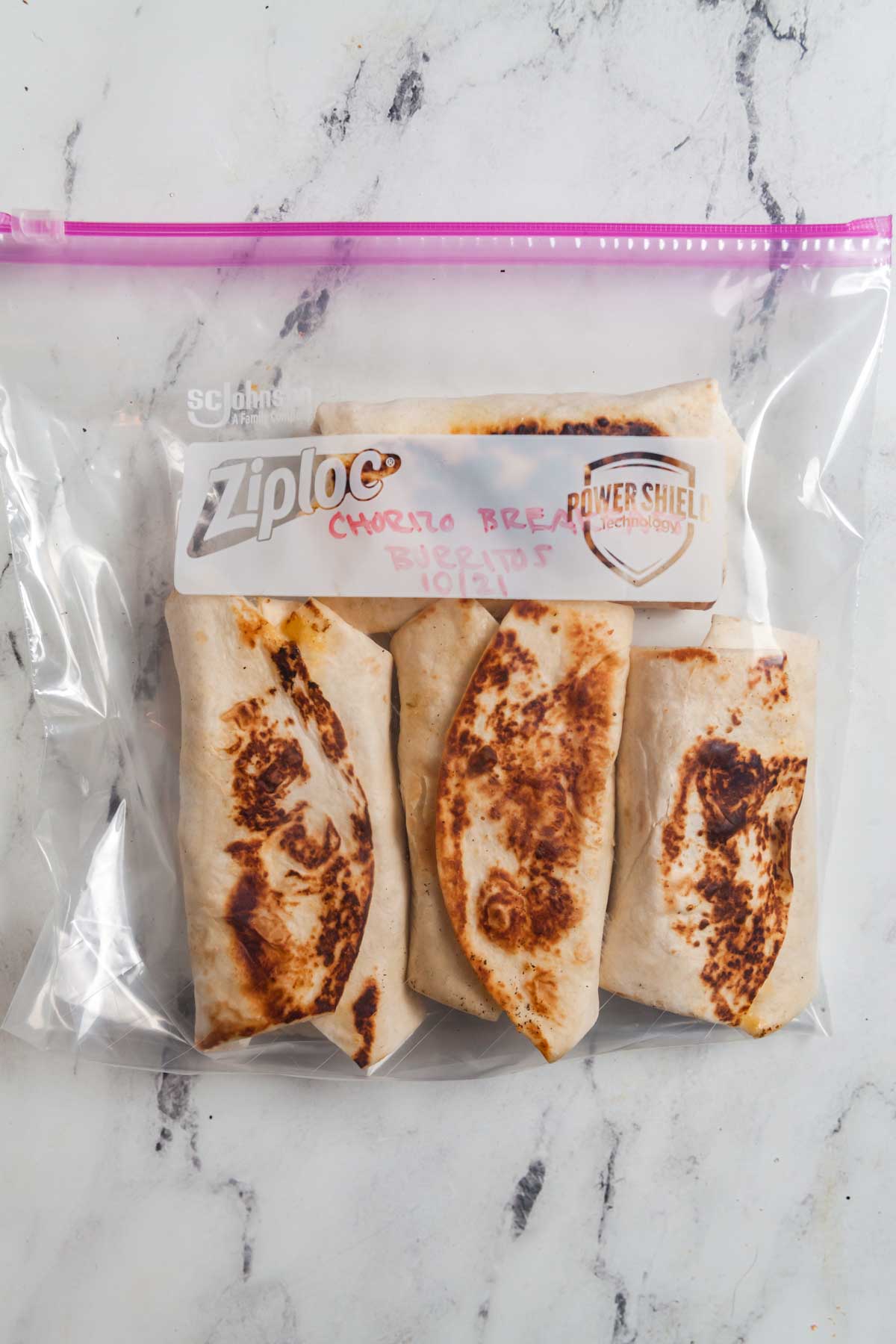 Wrap burritos individually then place in a labelled ziplock bag to freeze for later. 