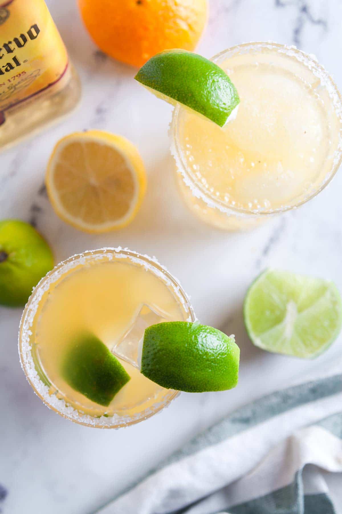 Overhead view of two margaritas: one is frozen and the other is on the rocks.