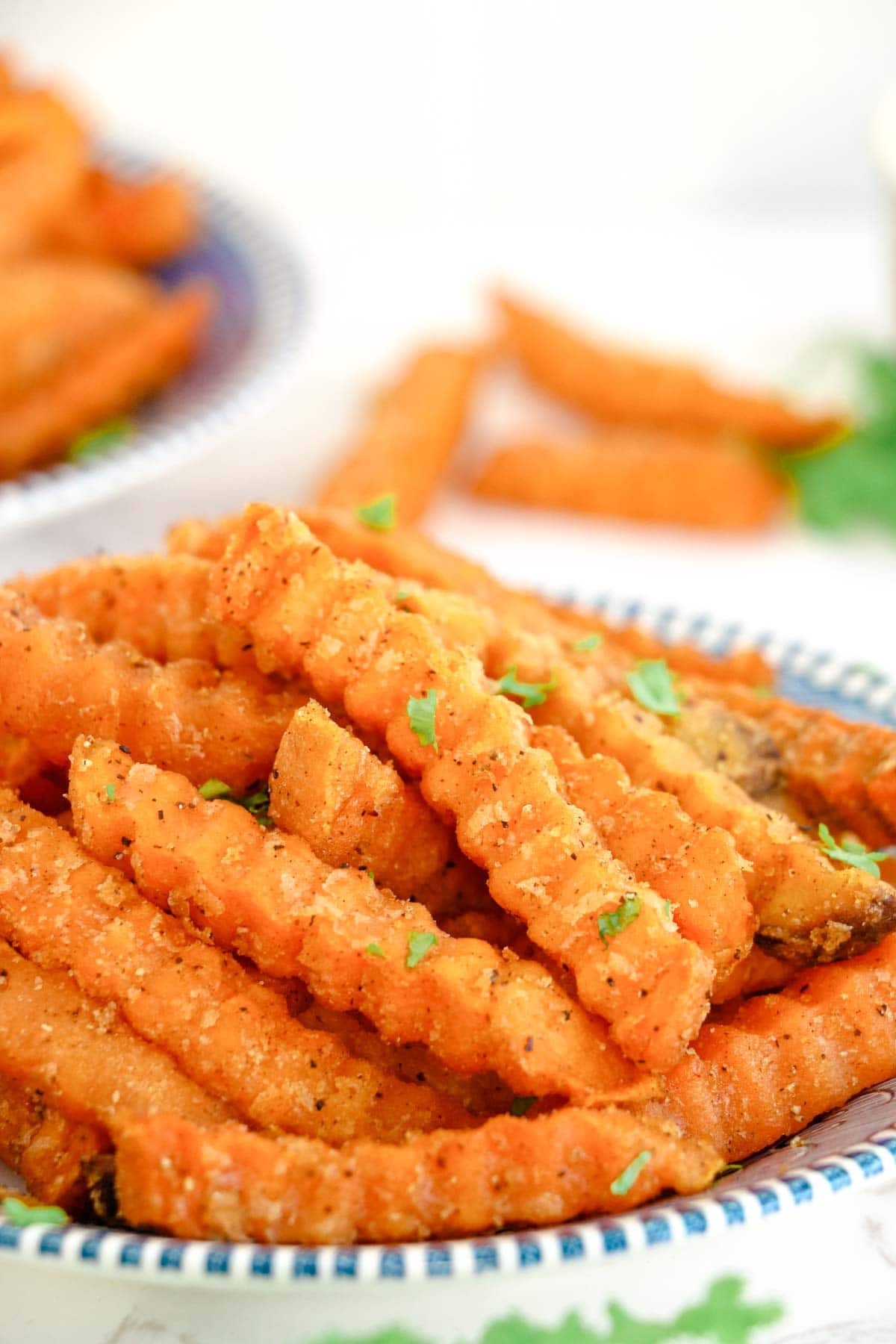 Cluseup view of a platter of crispy air fryer sweet potato fries