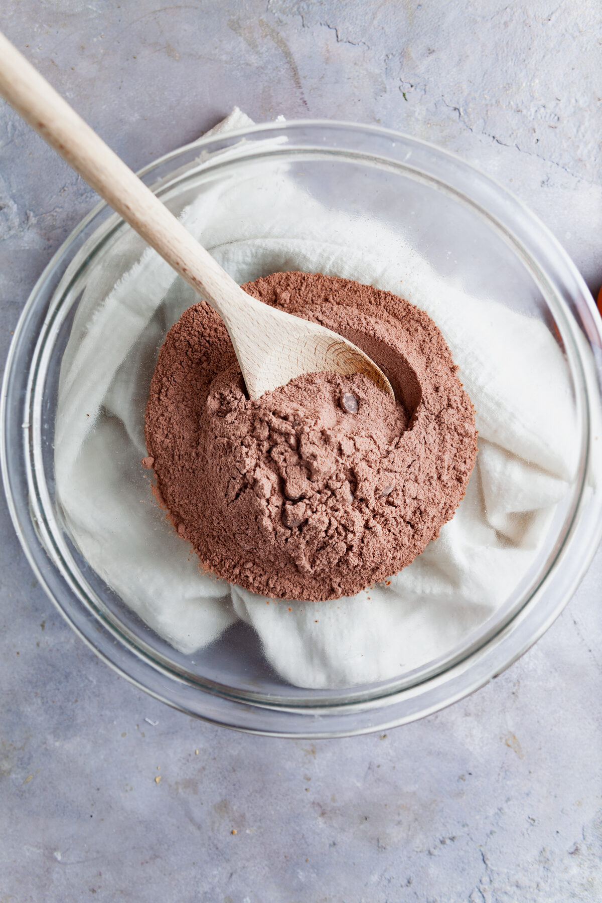 Mixing dry brownie mix in a bowl. 