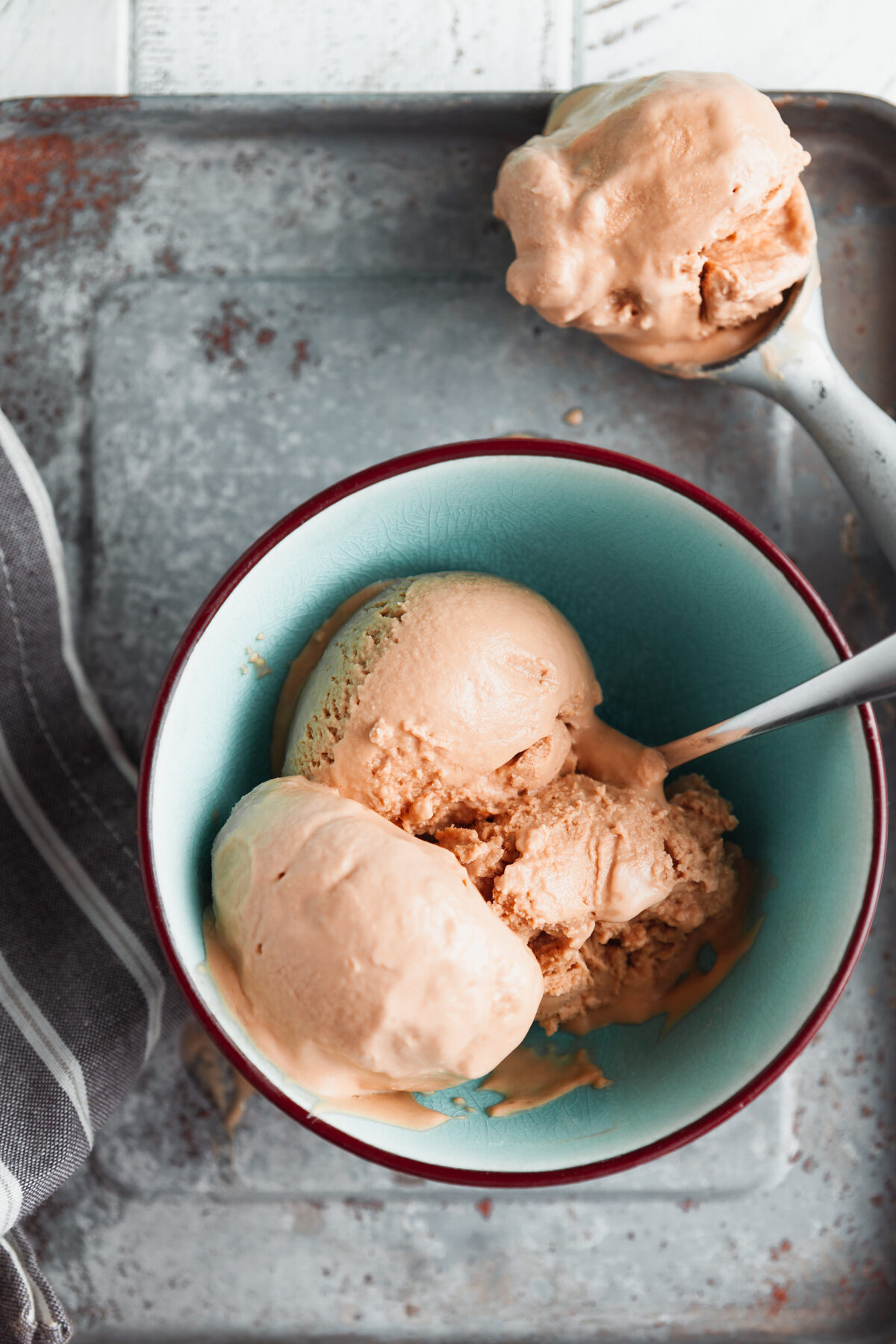 Overhead view of no churn coffee ice cream in a blue bowl. 
