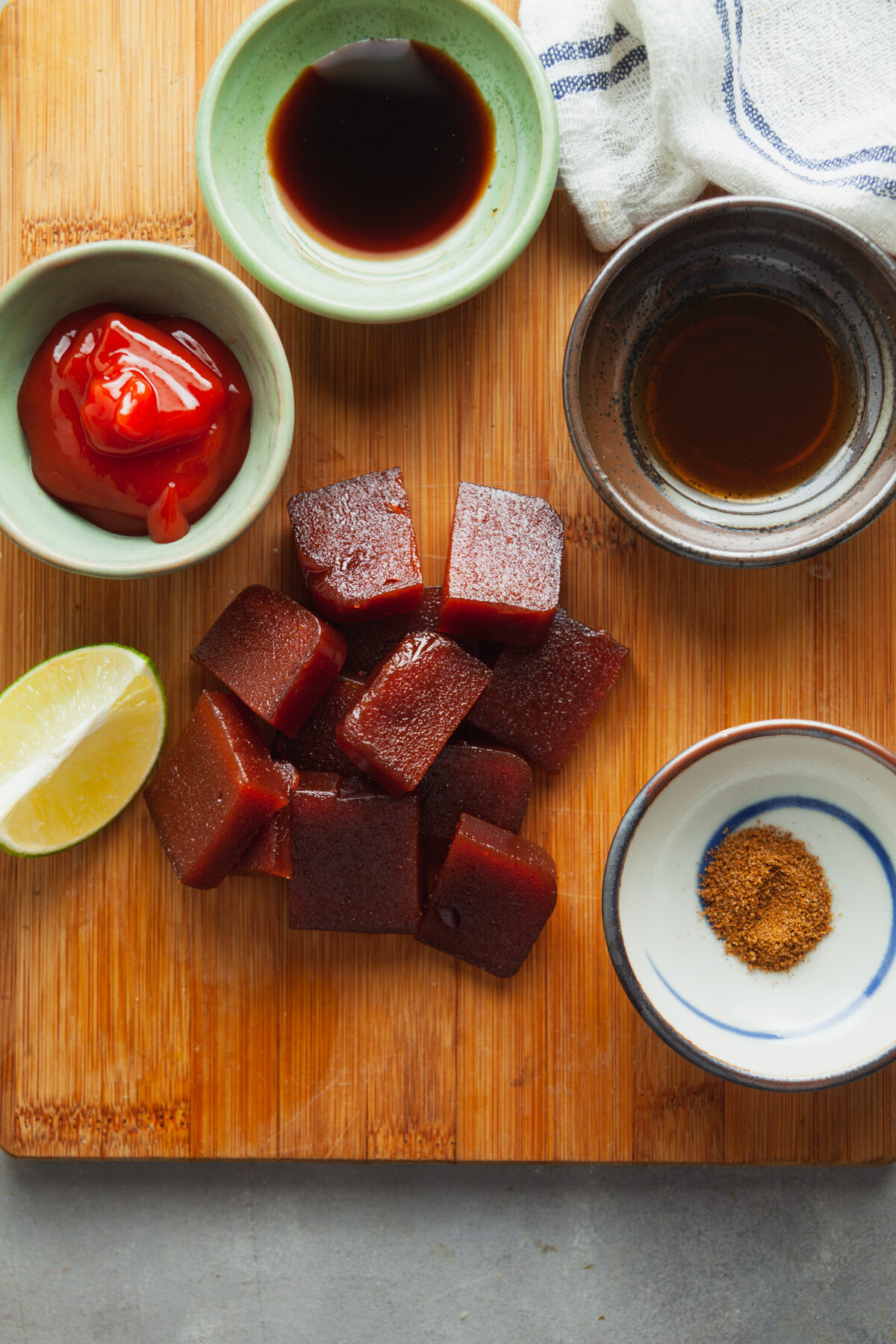 Ingredients to make homemade barbecue sauce sweetened with guava and flavored with jerk seasoning.