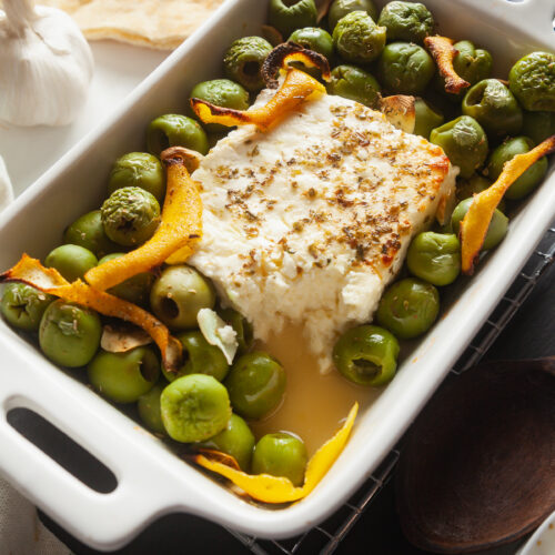 Baked feta with olives and lemon zest.