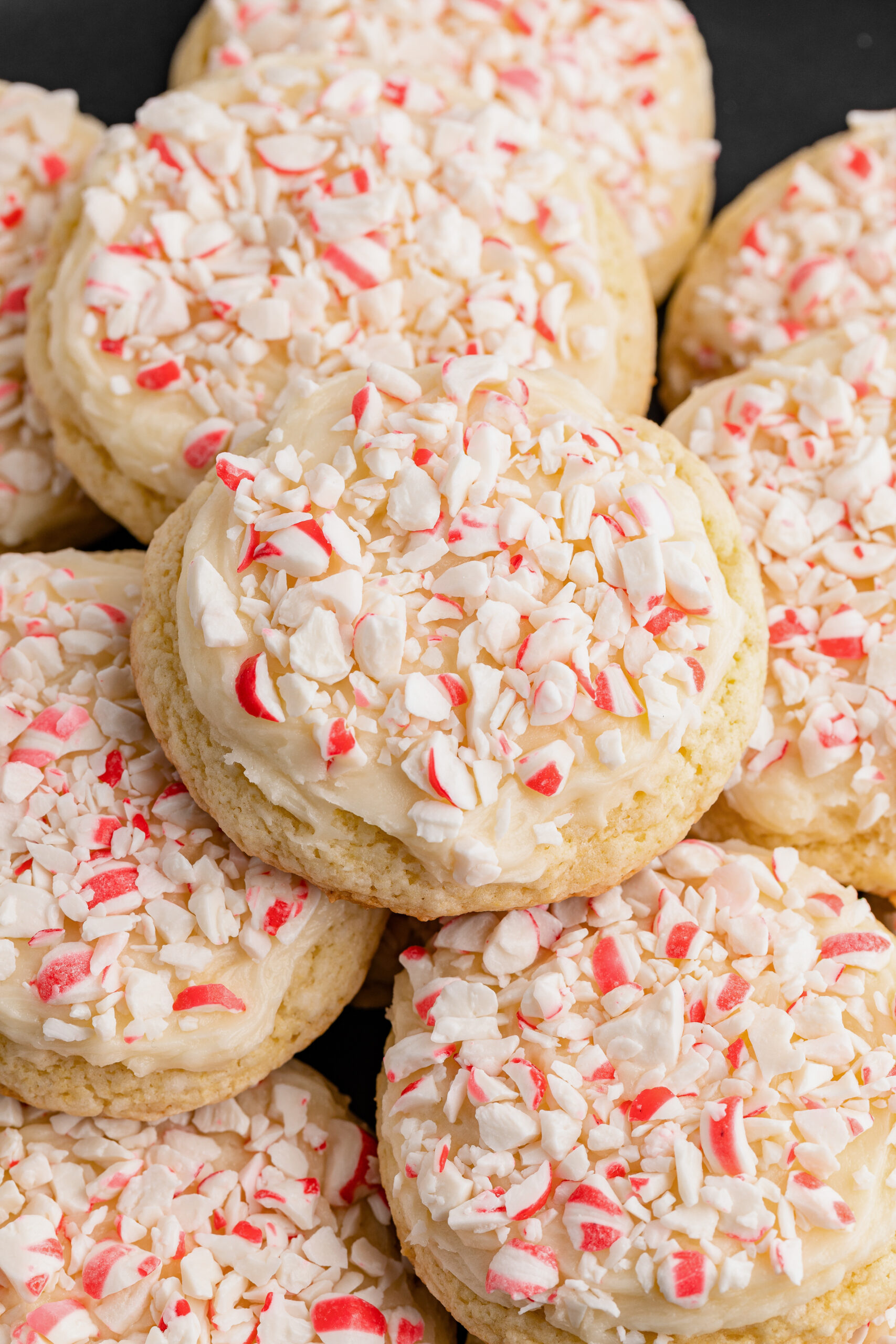 Closeup image of frosted peppermint cake mix cookies.