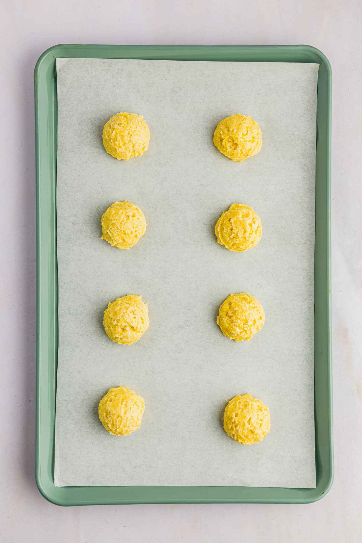 Arranging the cookies on a cookie sheer.