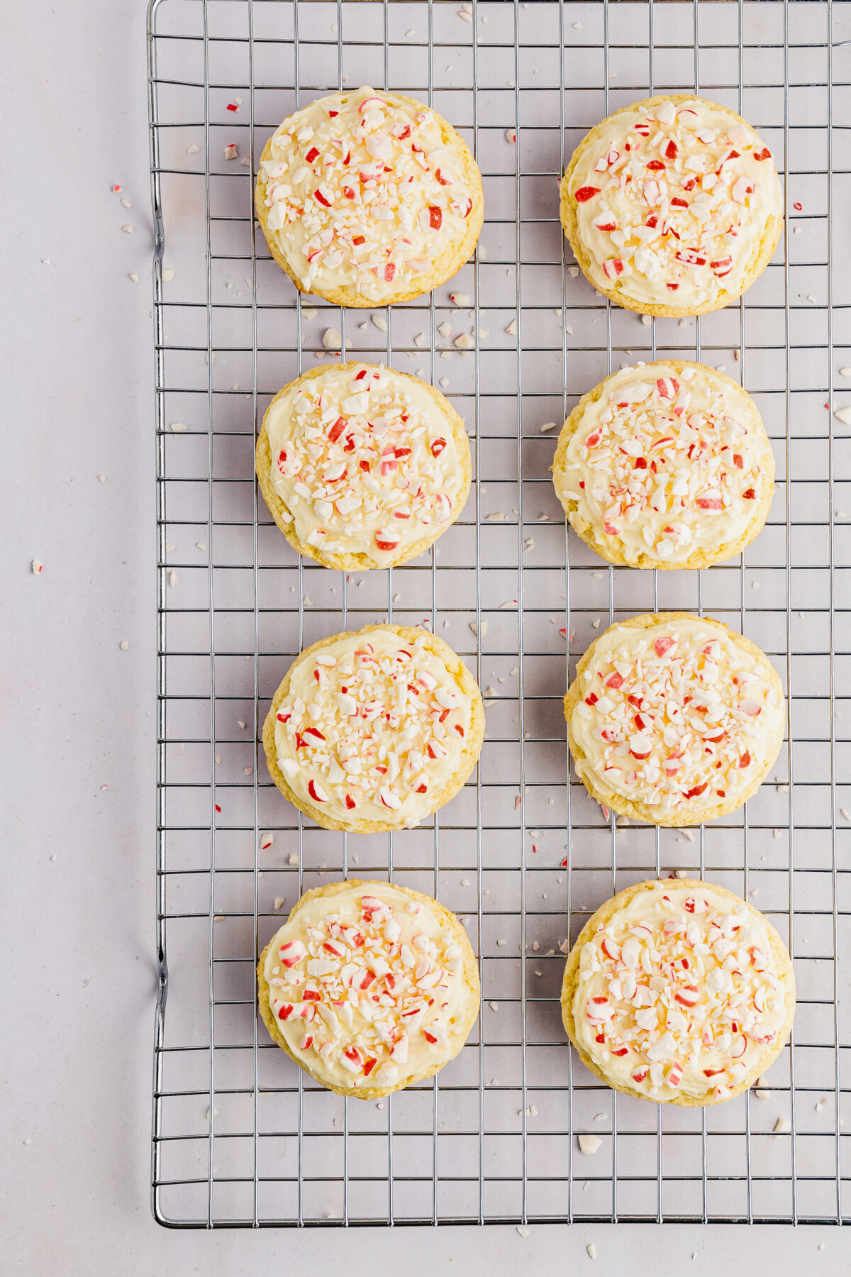 Decorated peppermint cake mix cookies in a cooling rack.