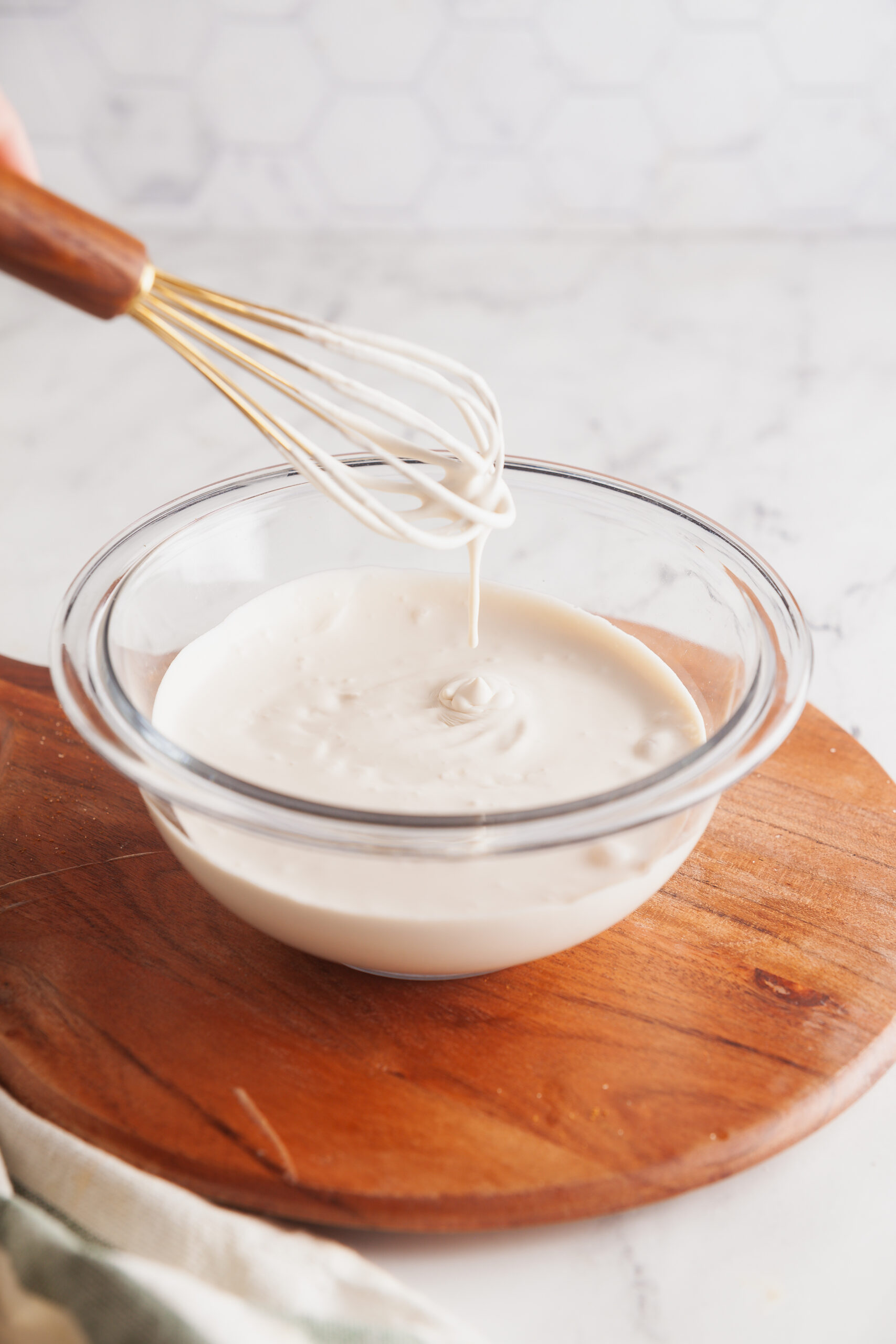 Whip the mixture until it's thickened and hold soft peaks. 
