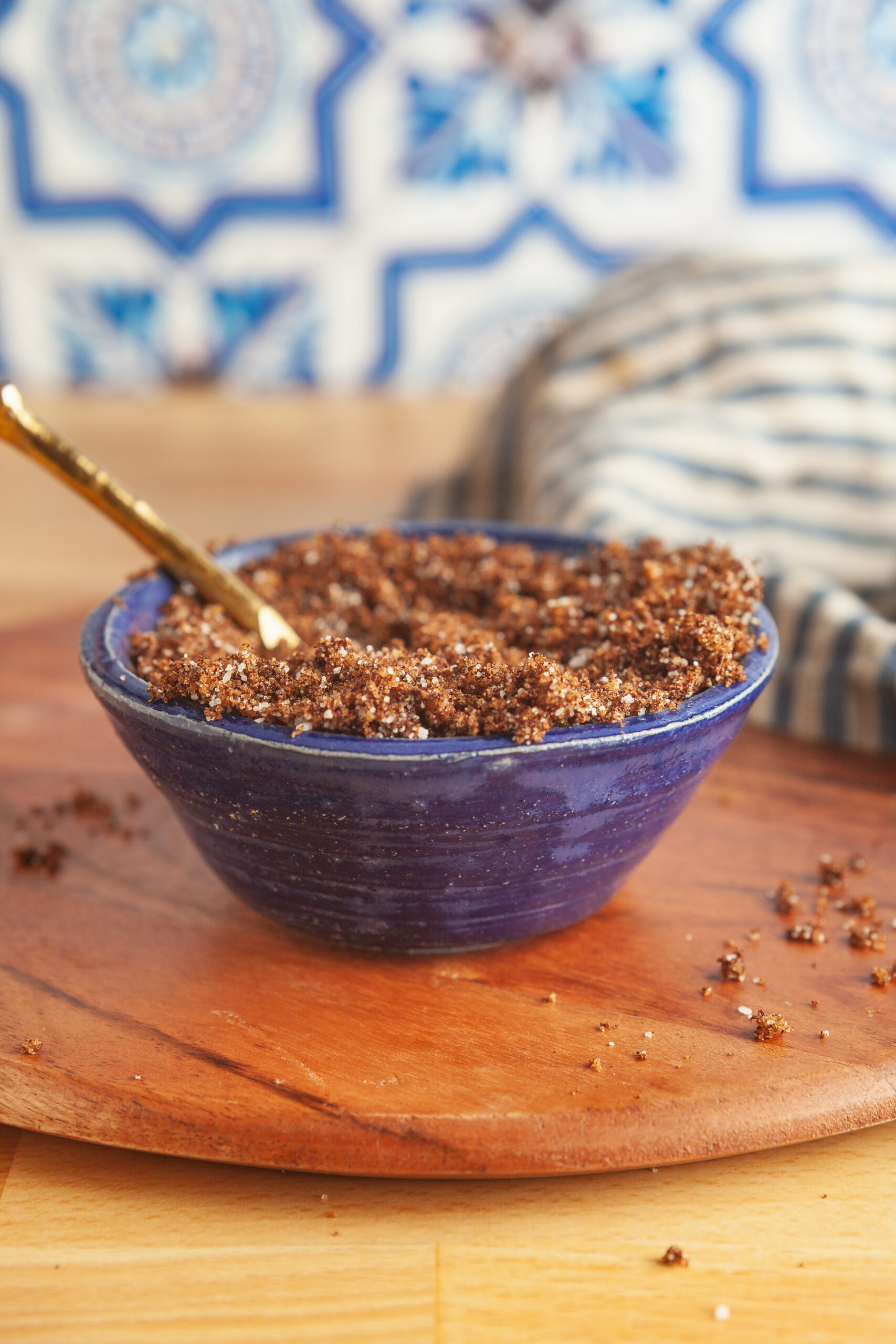 A blue pottery bowl with homemade coffee and chipotle steak rub. 