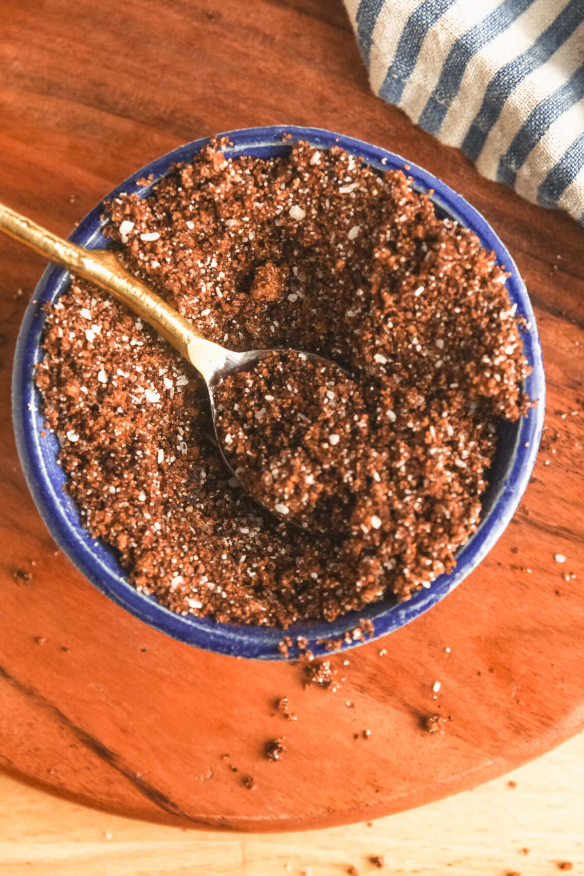 A blue pottery bowl with homemade coffee and chipotle steak rub.