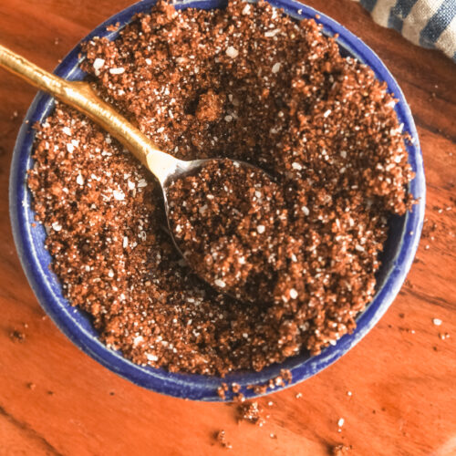 A blue pottery bowl with homemade coffee and chipotle steak rub.
