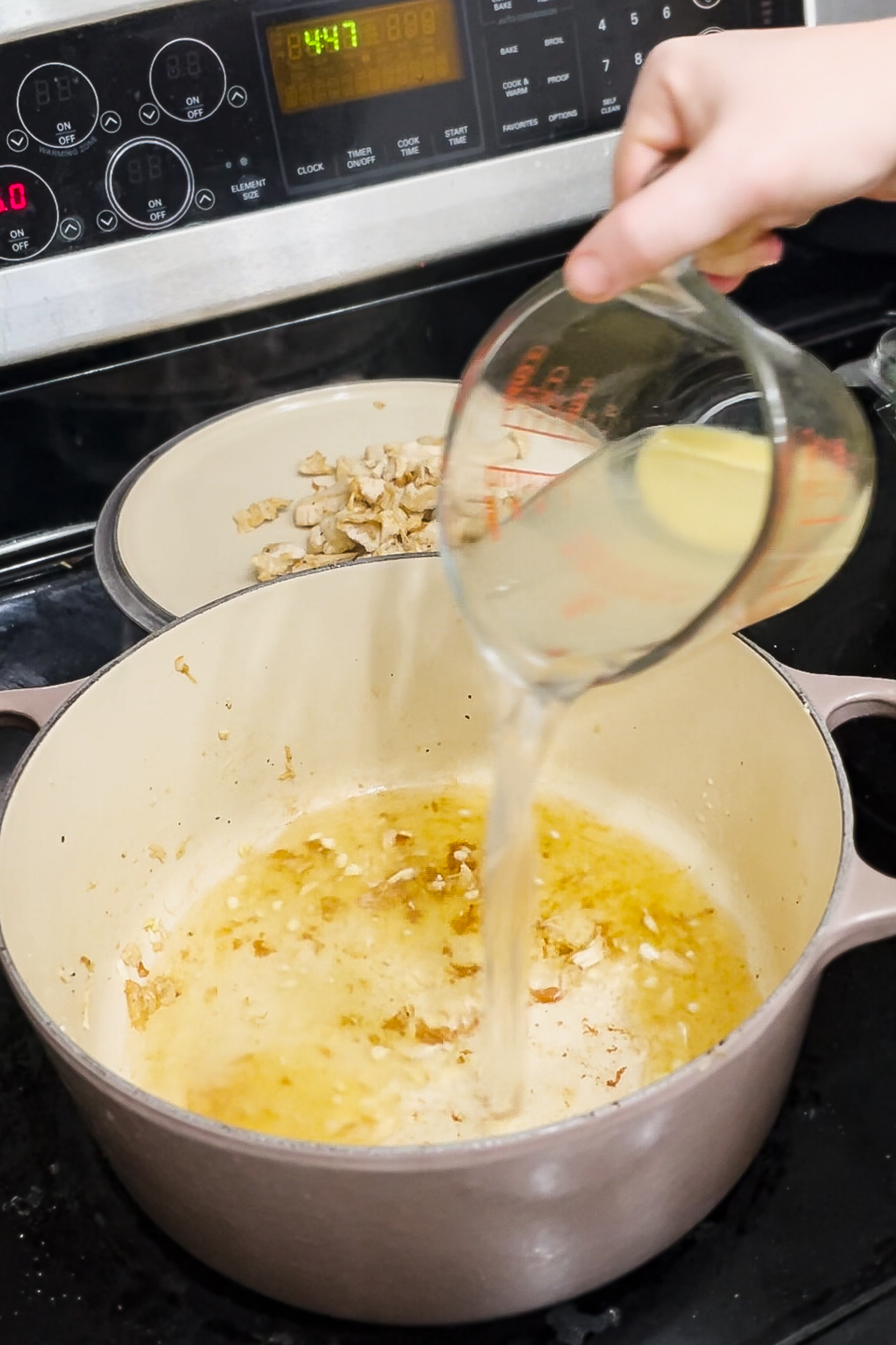 Adding broth. 