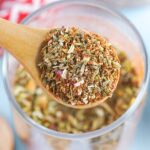 A spoon of homemade pizza seasoning.