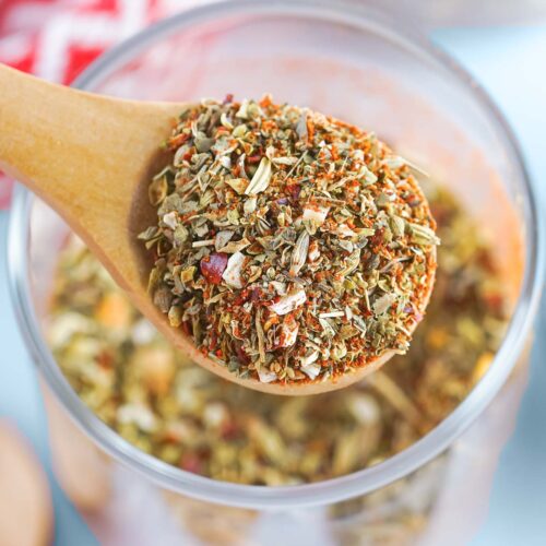 A spoon of homemade pizza seasoning.