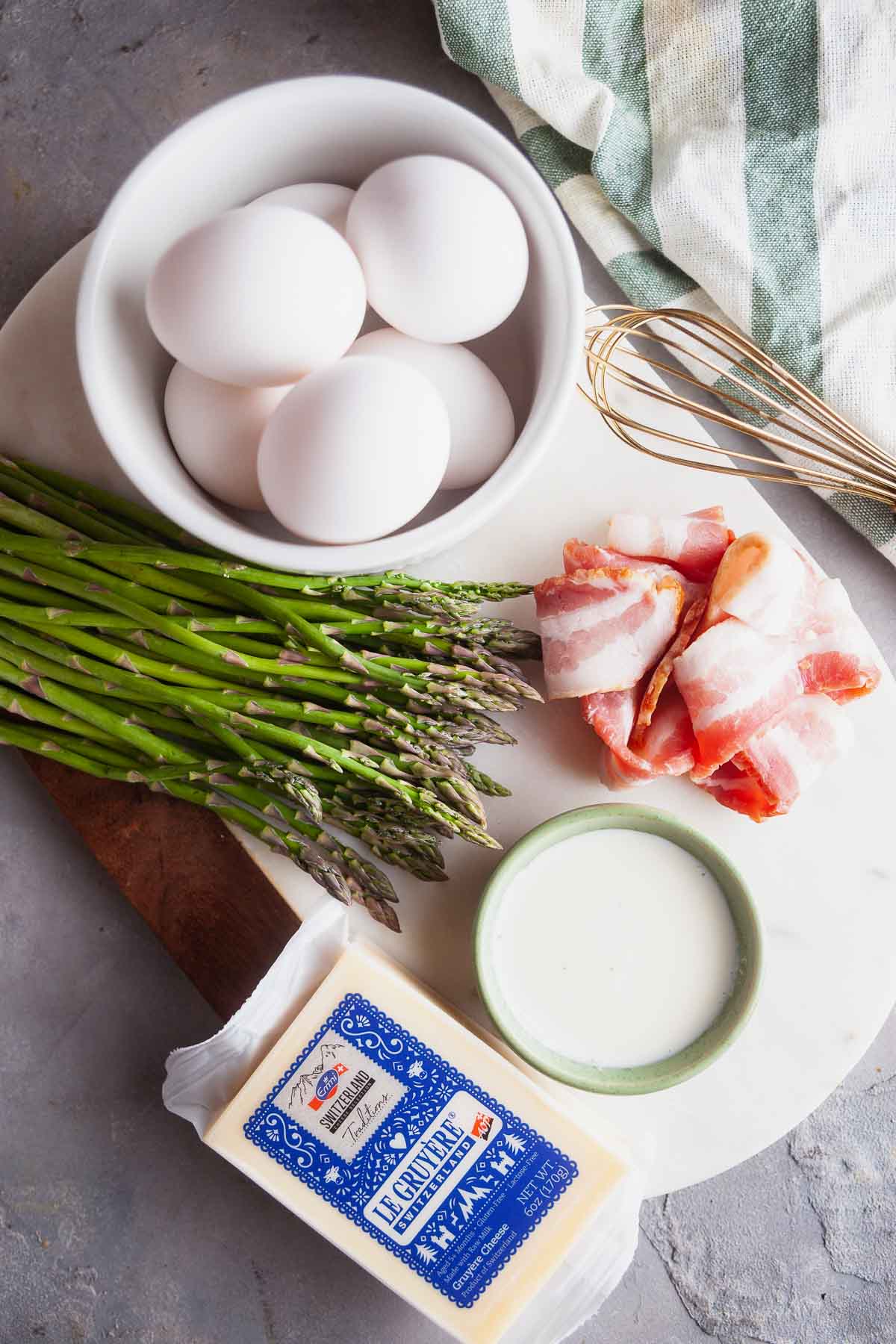 Ingredients for making an asparagus and bacon frittata. 
