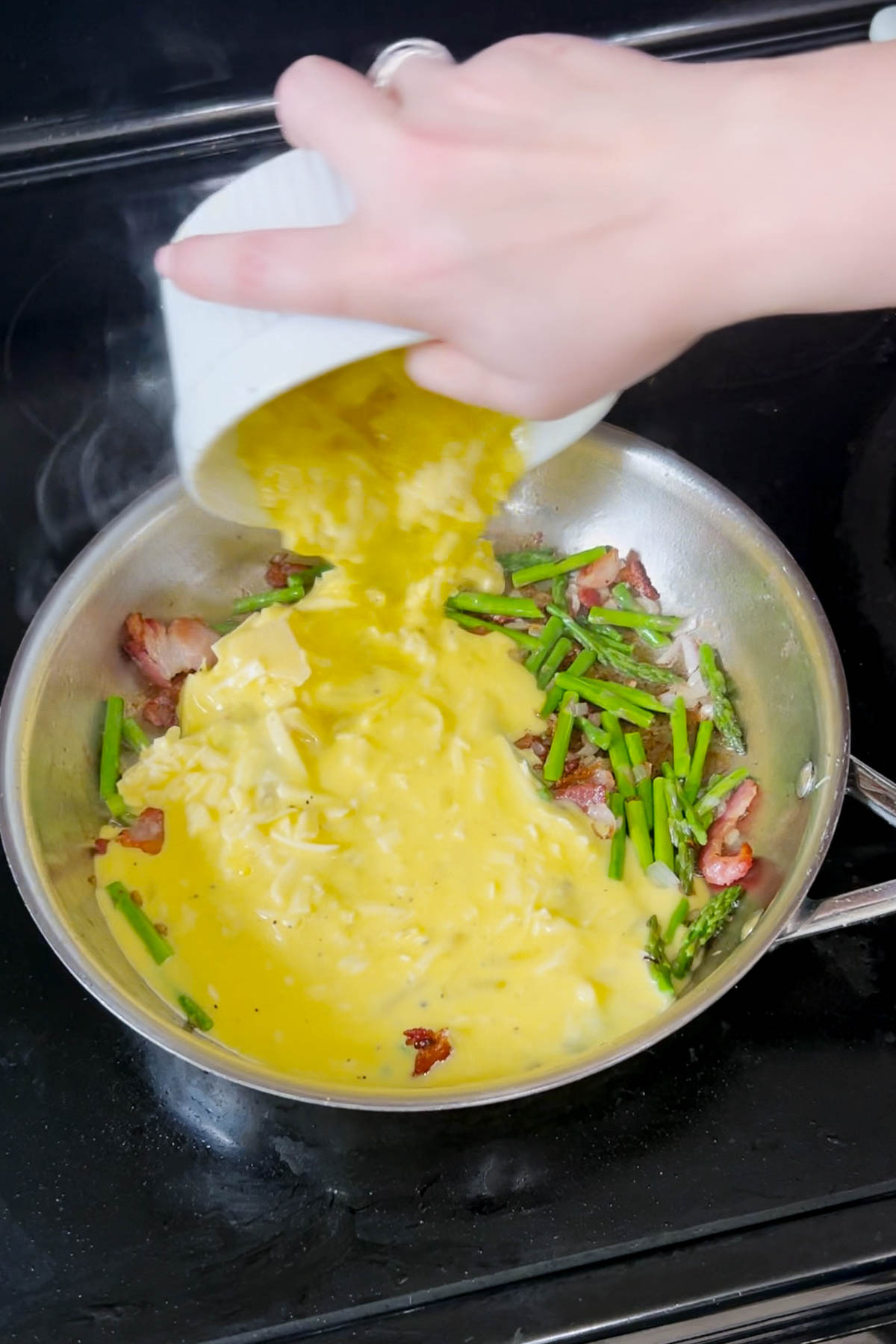 Pouring in the egg mixture. 