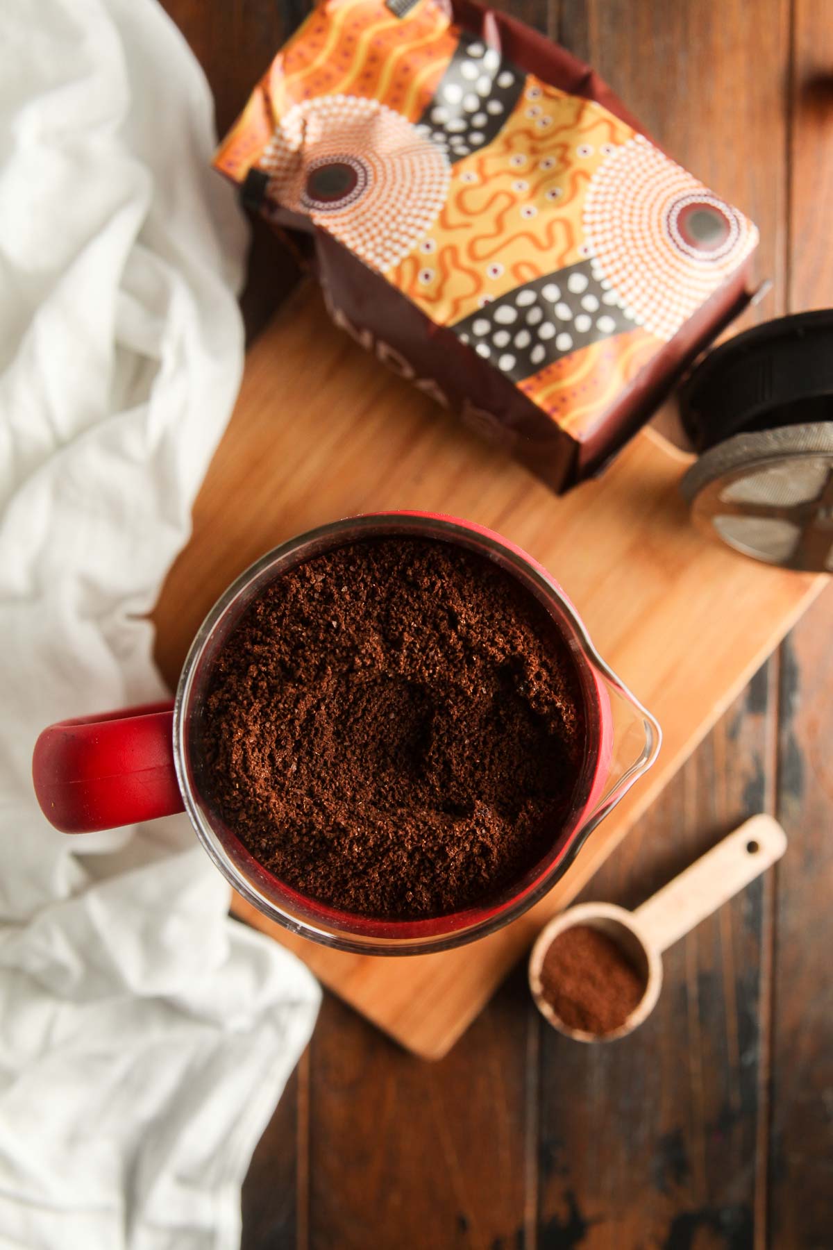 A french press filled with coffee grounds and water