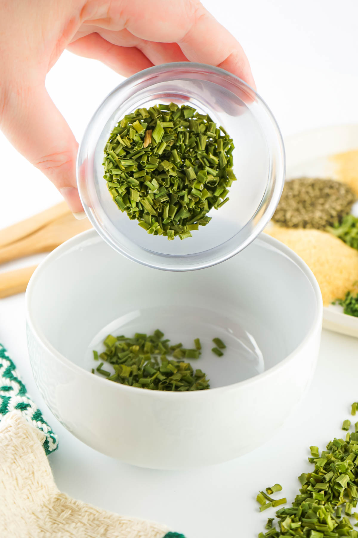 Adding dry chives. 