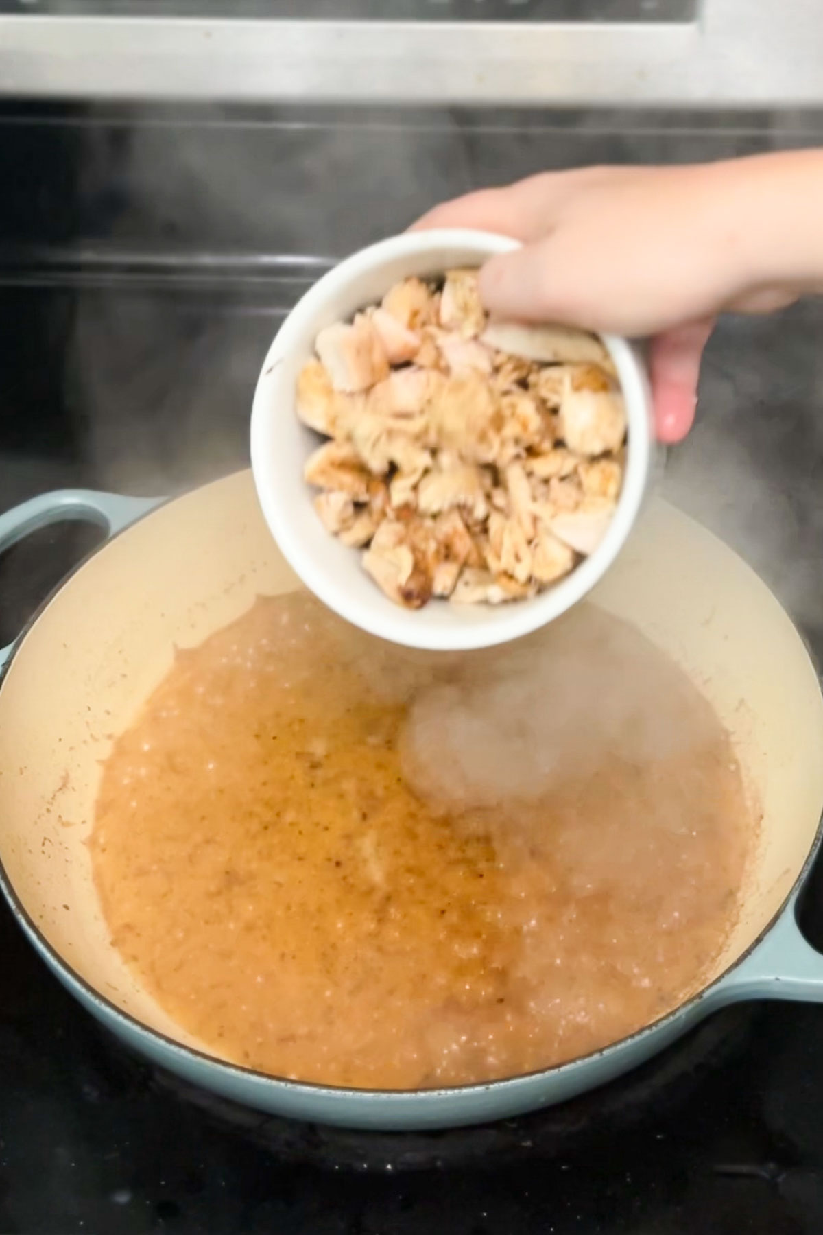 Adding the leftover cooked chicken to this pasta recipe. 