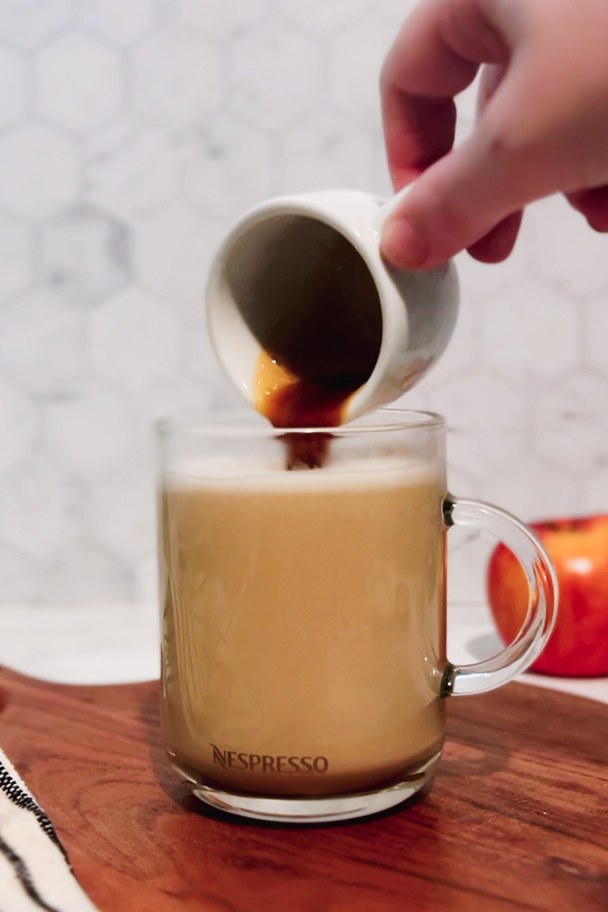 "Marking" the macchiato with espresso. 