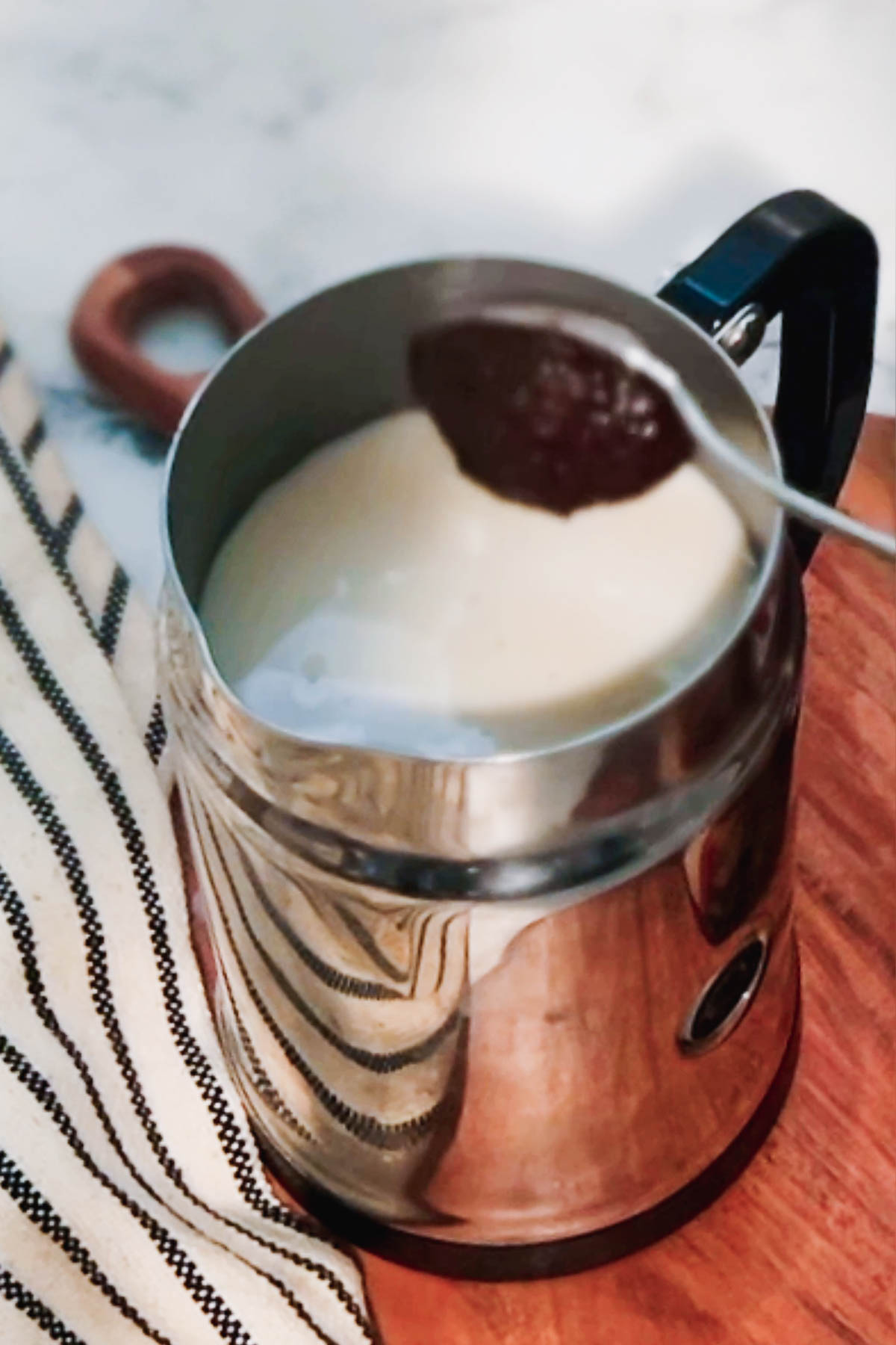 Adding apple butter before steaming the milk. 