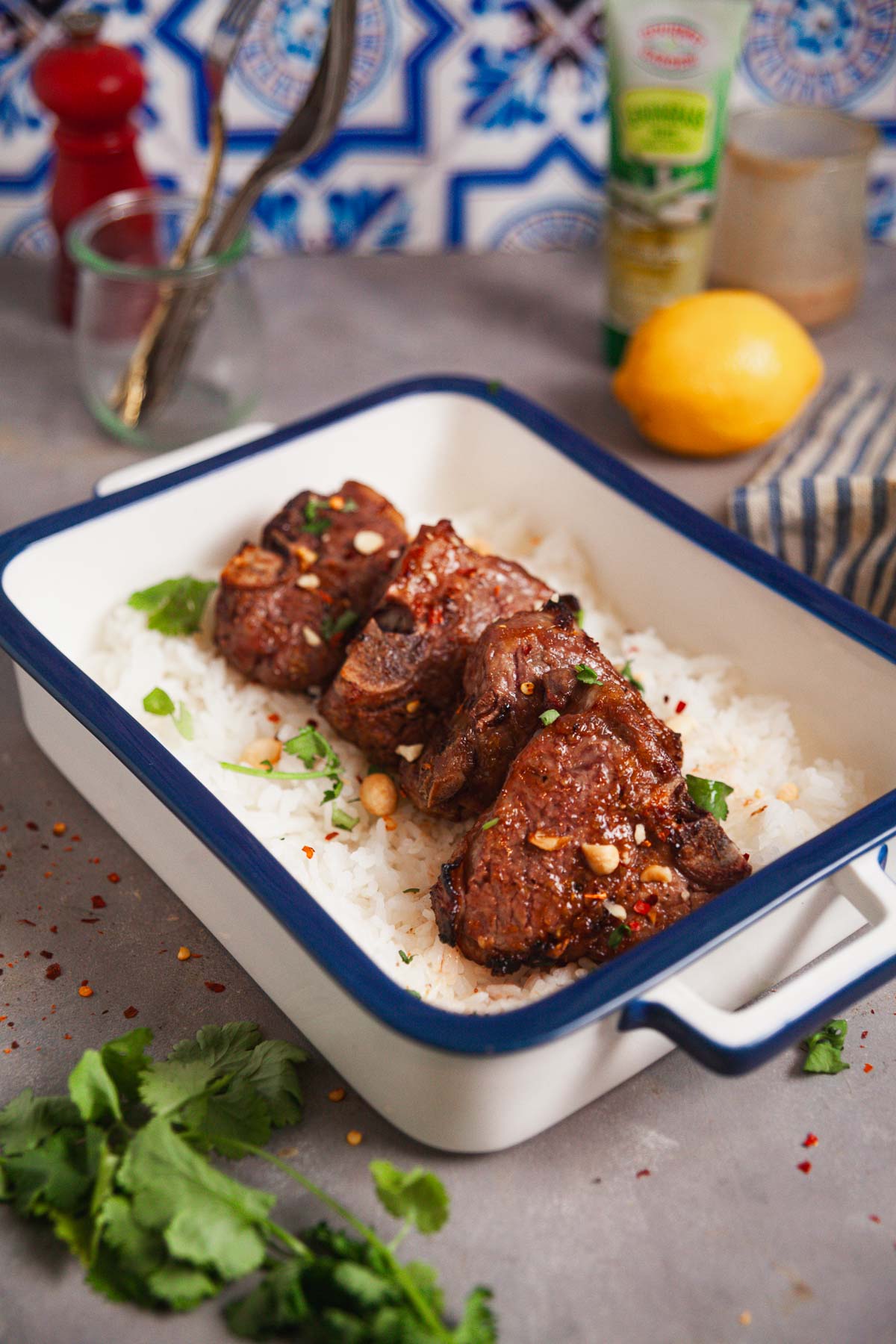 A platter of air fryer lamb loin chops over a bed of rice.