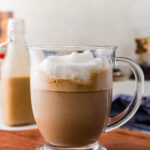 A glass coffee cut filled with a peanut butter latte.