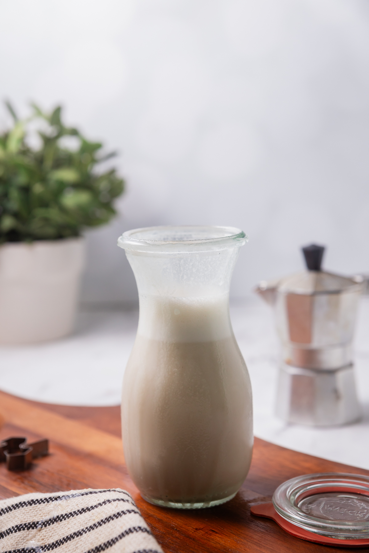 A glass bottle of homemade coffee creamer.