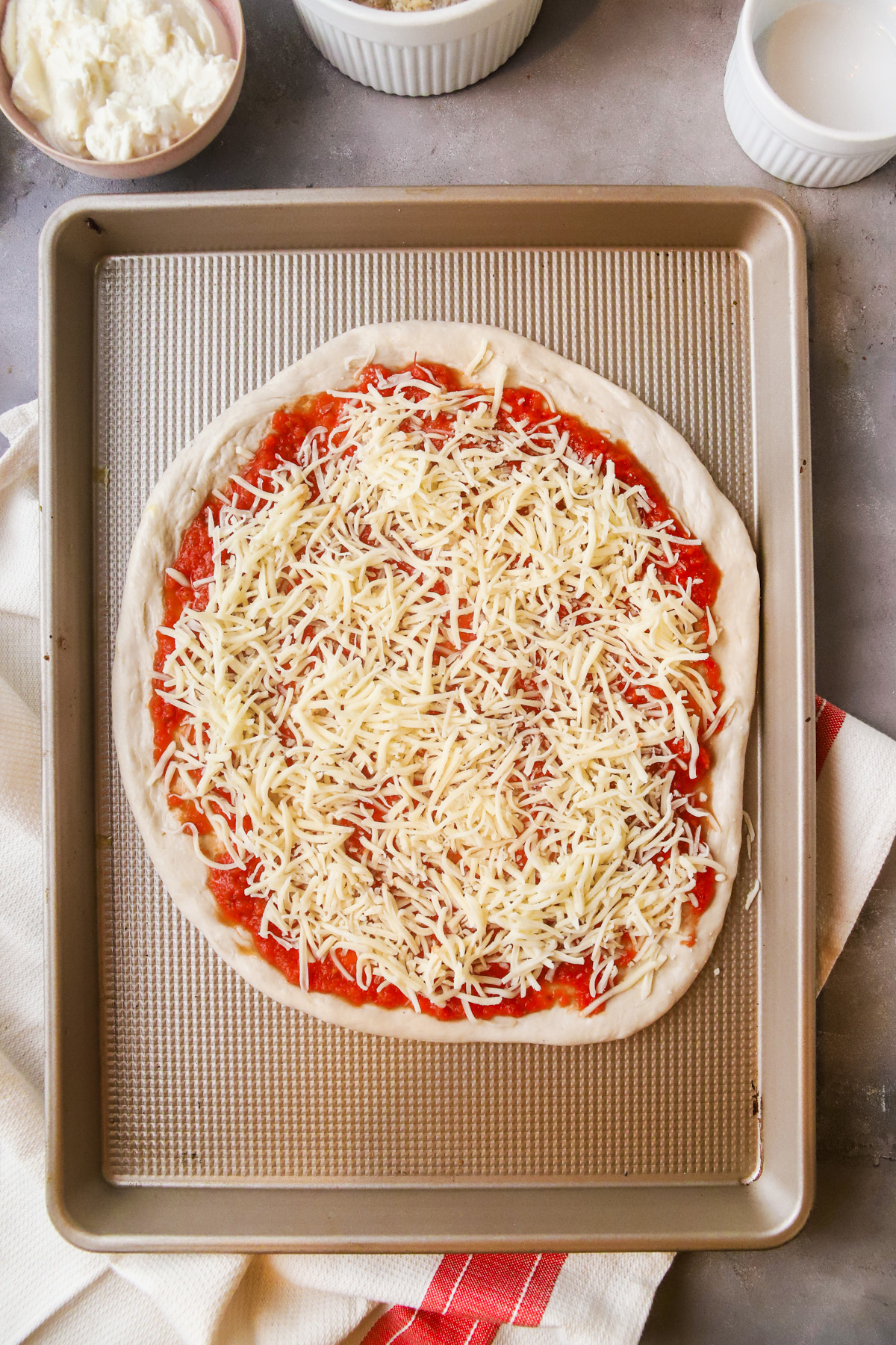 Top generously with shredded mozzarella cheese. 