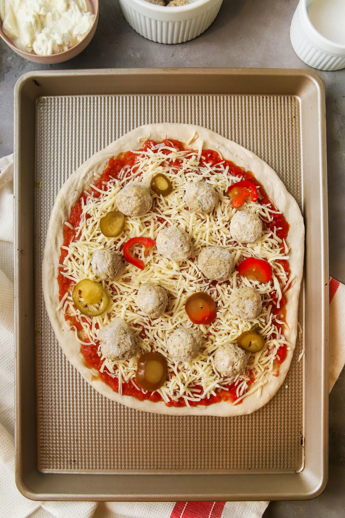 Add frozen meatballs and pickled cherry peppers. 