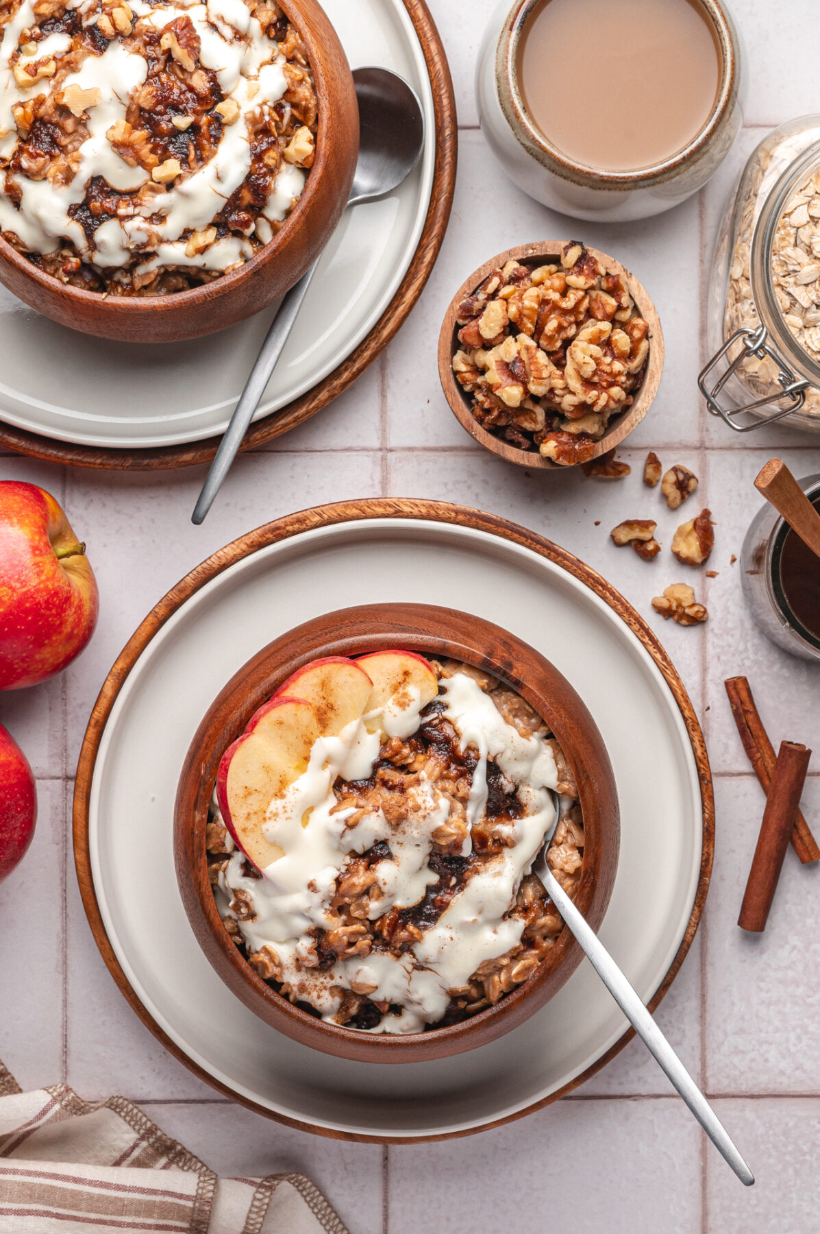 A wooden bowl fileld with homemade cinnamon roll oatmeal. 