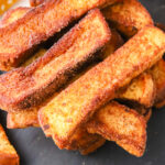 Close up view of apple cider french toast sticks.