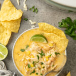 Crockpot white chicken chili with corn and queso.